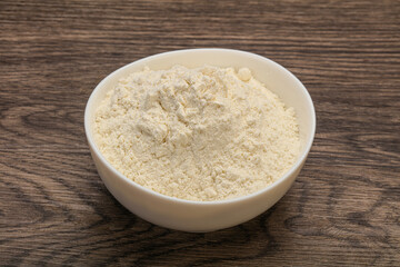 Wheat flour heap in the bowl