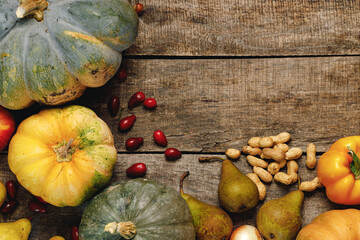 Beautiful composition with autumn vegetables on weathered wooden background