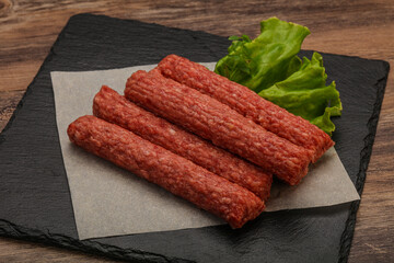 Raw beef sausages with spices