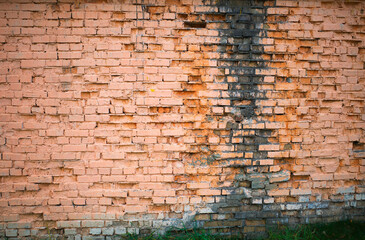Fototapeta na wymiar Abandoned red brick wall texture background