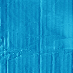 A blue vintage rough sheet of carton. Recycled environmentally friendly cardboard paper texture. Simple minimalist papercraft background.