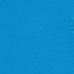 A blue vintage rough sheet of carton. Recycled environmentally friendly cardboard paper texture. Simple minimalist papercraft background.