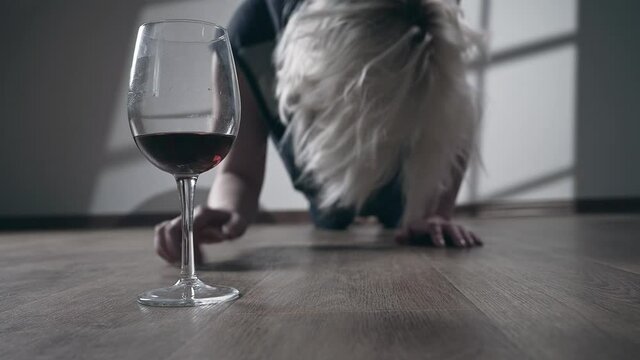 Miserable woman in depression, drinking alcohol