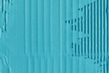 A blue vintage rough sheet of carton. Recycled environmentally friendly cardboard paper texture. Simple minimalist papercraft background.