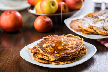homemade pancakes with apples poured with honey.
