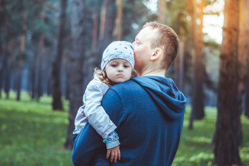 Fototapeta premium the father holds the house in his hands