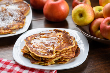 homemade pancakes with apples poured with honey.