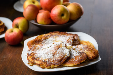 Naklejka na ściany i meble homemade apple pancakes sprinkled with powdered sugar.