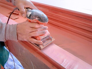  Carpenter are using a router cutting edge smoothing. Carpenters are building furniture.