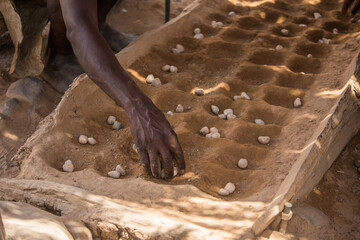 Damara people are playing with a typical african game  Namibia