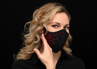blonde in a stylish medical mask with gems, handmade