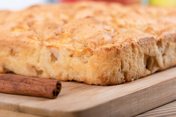 Soft focus. Delicious whole fresh baked apple pie with cinnamon.