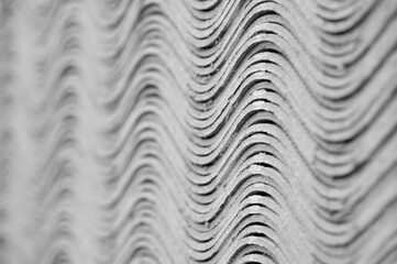 Bundle of wave slate stacked as an abstract background with shallow depth of field
