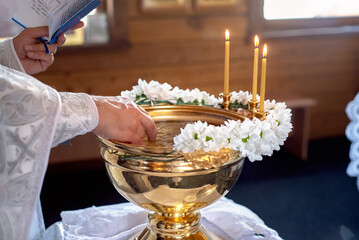 object anointing cross Epiphany baby