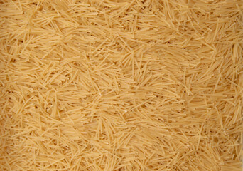 Raw vermicelli pasta background texture