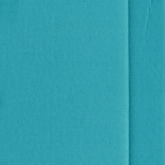 A blue vintage rough sheet of carton. Recycled environmentally friendly cardboard paper texture. Simple minimalist papercraft background.