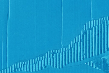 A blue vintage rough sheet of carton. Recycled environmentally friendly cardboard paper texture. Simple minimalist papercraft background.