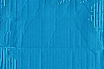 A blue vintage rough sheet of carton. Recycled environmentally friendly cardboard paper texture. Simple minimalist papercraft background.