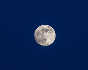 Fototapeta na wymiar Full moon on the background of the night sky in winter