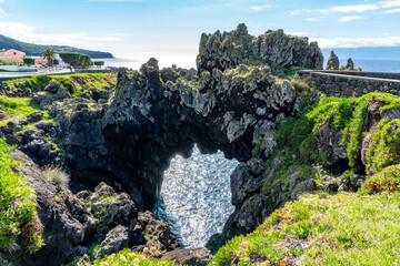 Azores, Island of Sao Jorge, beautiful natural lava stone Arch in Velas. (Arco natural)