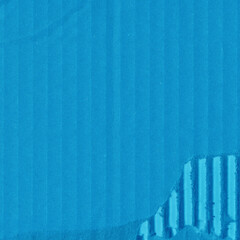 A blue vintage rough sheet of carton. Recycled environmentally friendly cardboard paper texture. Simple minimalist papercraft background.