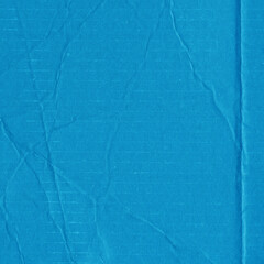 A blue vintage rough sheet of carton. Recycled environmentally friendly cardboard paper texture. Simple minimalist papercraft background.