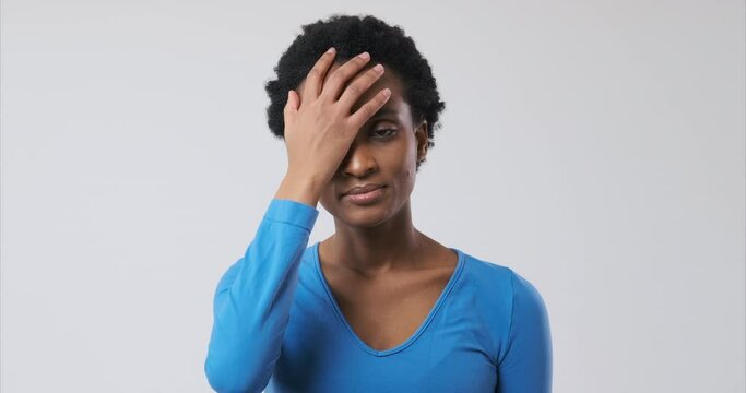 Disappointed african american woman regretting her deeds