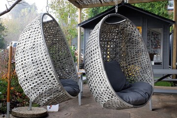 Two hanging egg chairs outside pub during the Coronavirus (Covid-19) pandemic
