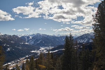 View over the Fassa Valley in the Dolomites from the Rosengarten ski area with the village of Soraga di Fassa