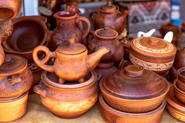 Handmade clay tableware for sale to tourists, kettle, saucepan,
