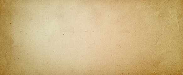 Old brown paper parchment background design with distressed vintage stains and ink spatter and white faded shabby center, elegant antique beige color