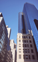 New York City old and modern architecture, color toning applied, USA.