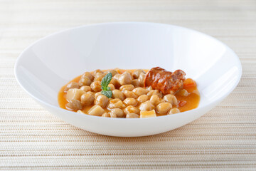 Stew with chikpeas and sausage, typical spanish