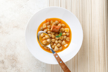 Stew with chikpeas and sausage, typical spanish