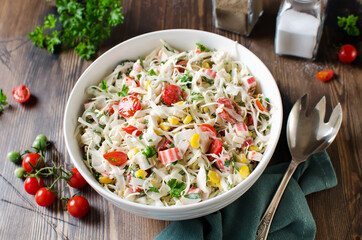 Salad with crab sticks, cabbage and tomatoes
