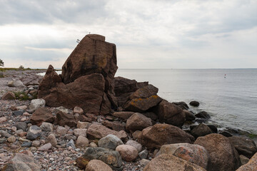 Fototapeta na wymiar Boulders on the Baltic sea coast. Daytime.