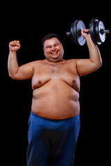 Fototapeta na wymiar Fat man doing workout traning with dumbbells. Happy guy isolated over yellow background.