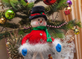Soft toy "Snowman" at the Christmas tree
