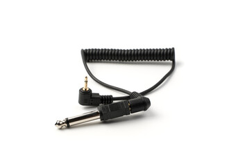 The sync cable with the connector and plug is isolated on a white background. Concept of accessories for equipment.