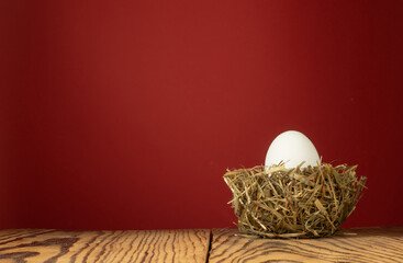image of chicken eggs in a nest of hay close-up