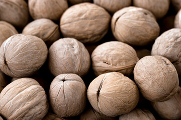 Walnuts kernels background. Fresh walnuts harvest. Selective focus.