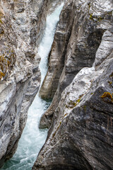 Fototapeta na wymiar waterfall in the mountains at Maligne Canyon at Jasper National Park