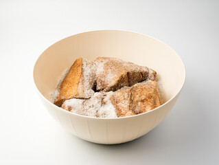 Plastic bowl with the product inside on a light background. the concept of cooking.