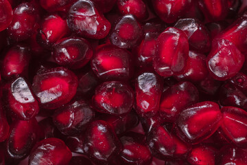 vibrant red pomgranate seeds close up shot