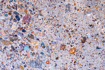 Surface with different color small stones. Natural mosaic.