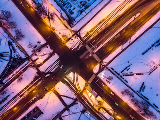 Aerial winter sunset drone view. Crossroads of walkways in the residential district