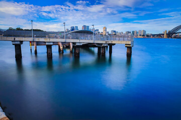 Fototapeta na wymiar Camera Shutter Long Exposure view of Sydney Harbour Bridge viewed from Balmain wharf