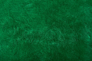 Green faux fur backdrop, new year or christmas background concept