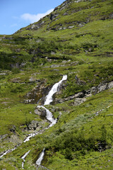 Fototapeta na wymiar Waterfall in the Scandinavian Mountains