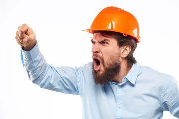 Angry man in orange hard hat industry work dissatisfaction cropped view